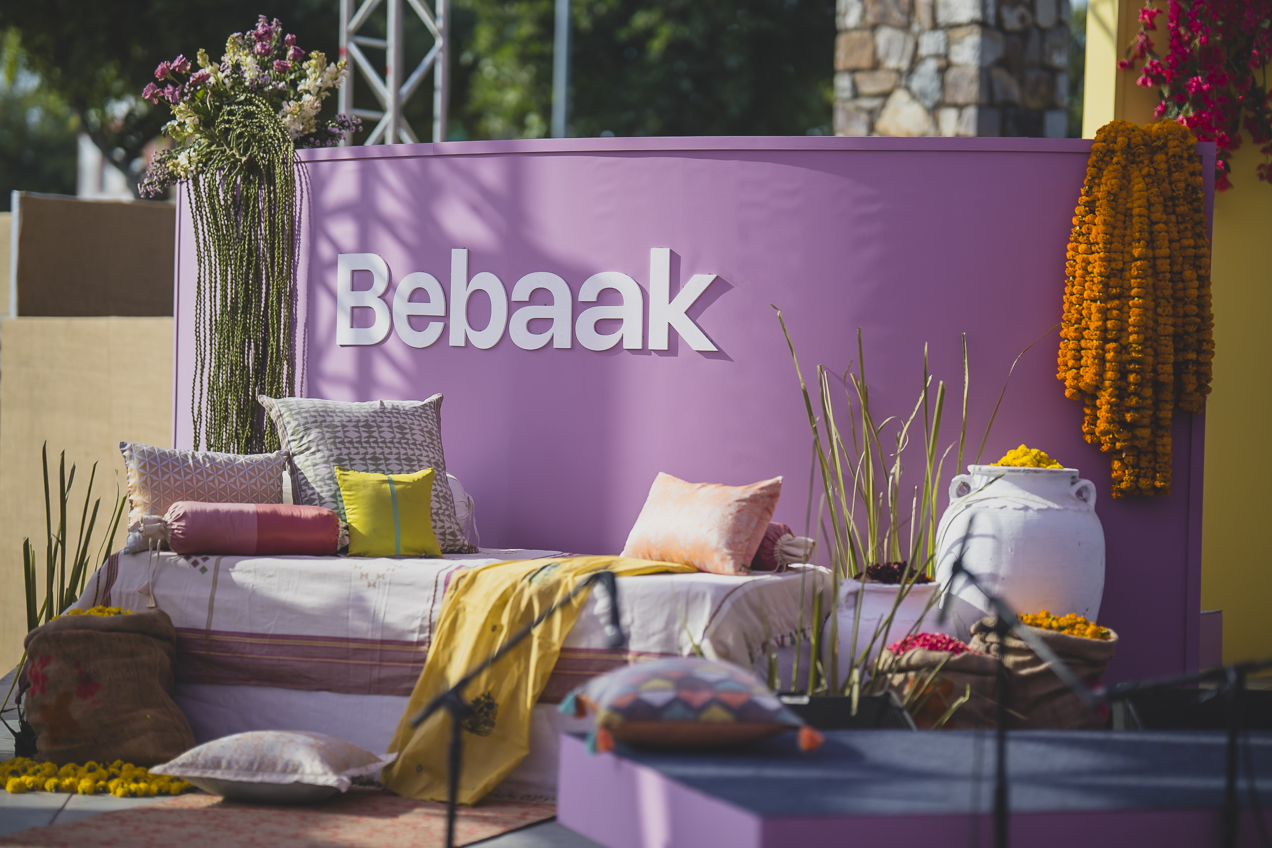 The intimate Bebaak Mehfil setting with cushions and plants